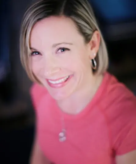 Amanda B. Smith, founder of ABS Pilates, smiling in the studio